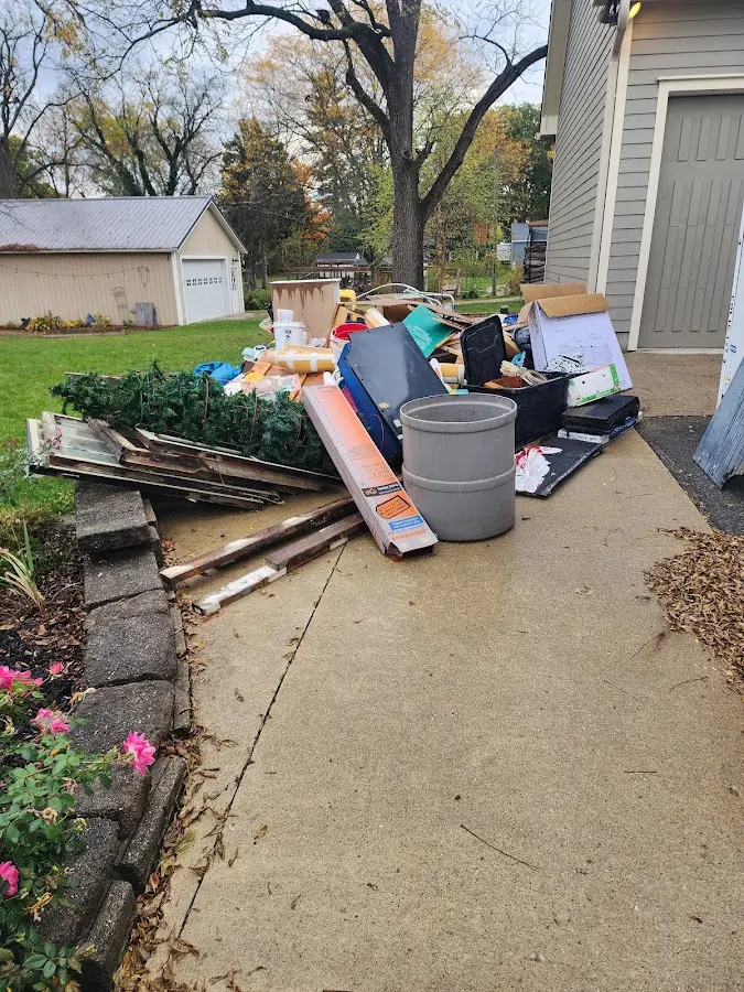 Dumpster being loaded with debris for Commercial Dumpster Rental in Willits